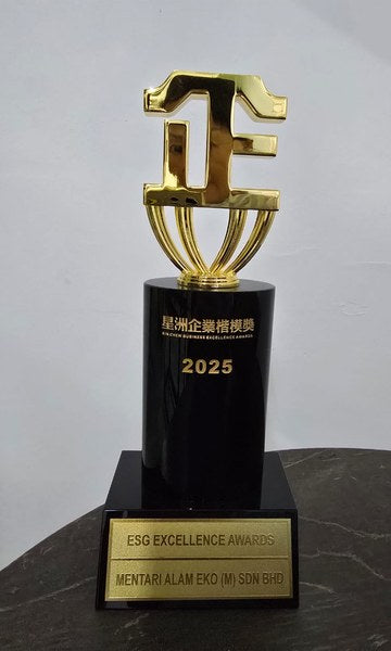 The 2025 Sin Chew Business Excellence Awards ESG Excellence Award trophy: a gold emblem on a black column